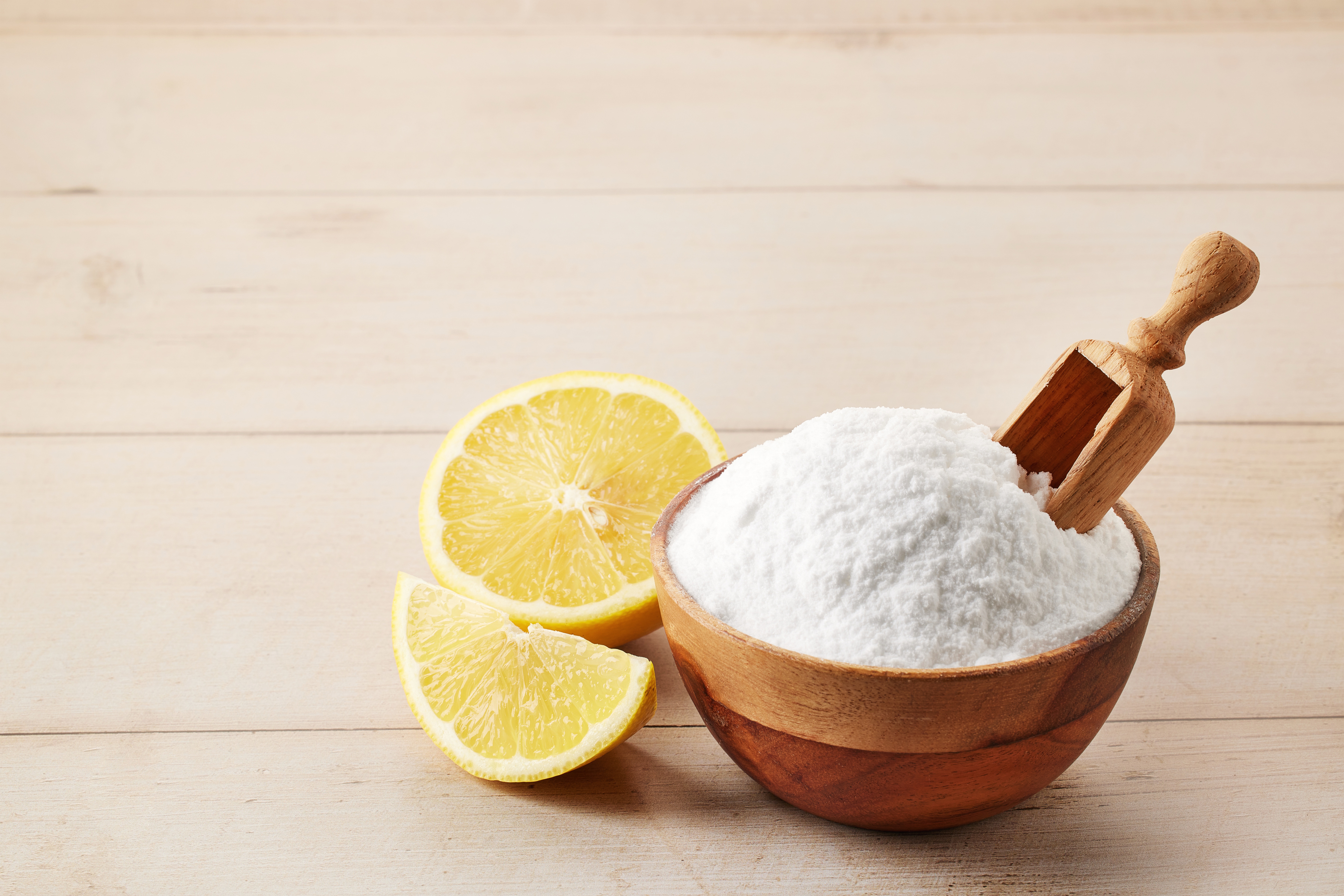 Natural ingredient flatlay on a light stone surface, organic beverage formulation context for citric acid and gum acacia