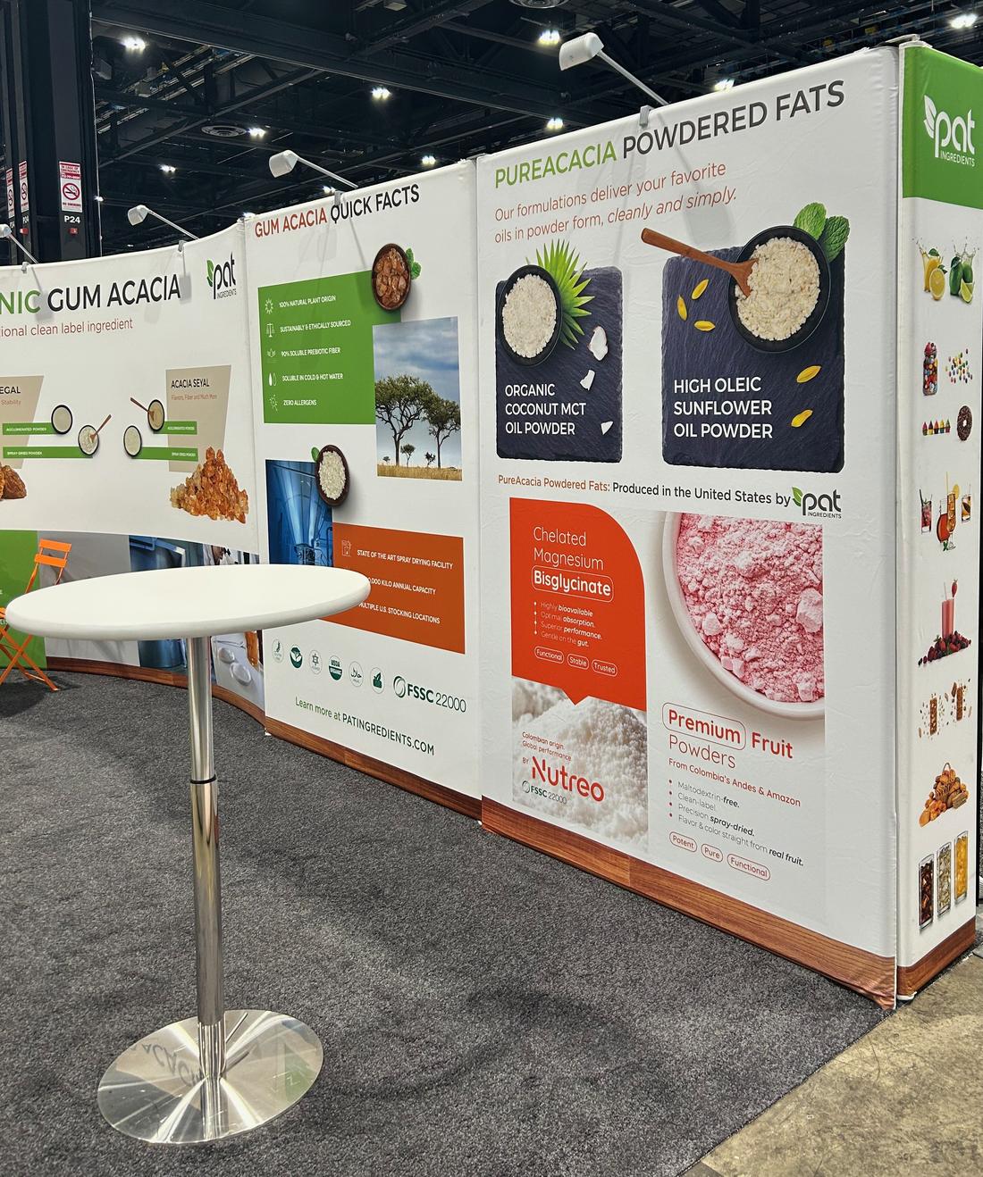 The PAT Ingredients booth, with gum acacia, PureAcacia powdered fats and fruit powder panels
